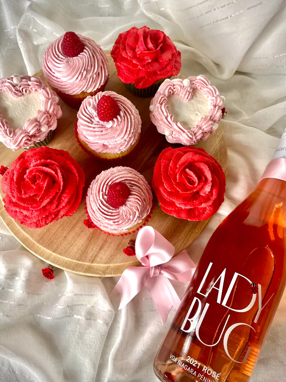 Decorated cupcakes with rose frosting