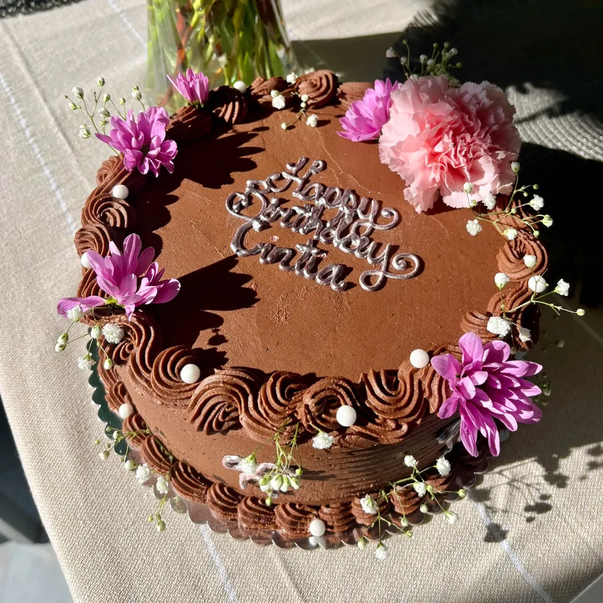 Chocolate birthday cake with flowers